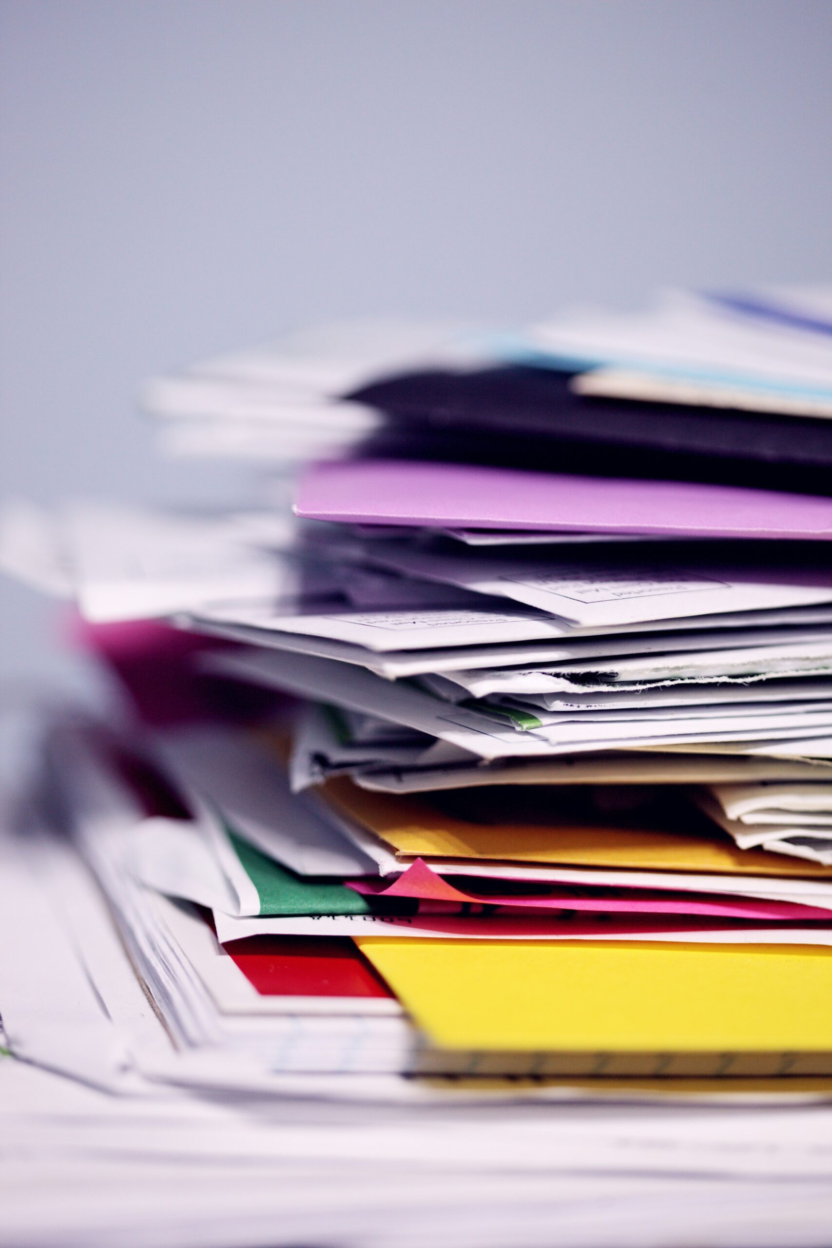 a pile of folders stacked on top of each other